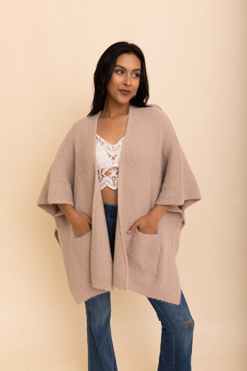 Beige boucle cardigan by Periwinkle Aether, cozy and stylish accessory perfect for autumn nights.