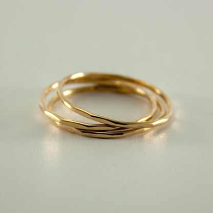 Hammered 14k gold filled slim ring stack by Grey Clymene featuring multiple stacked delicate gold bands