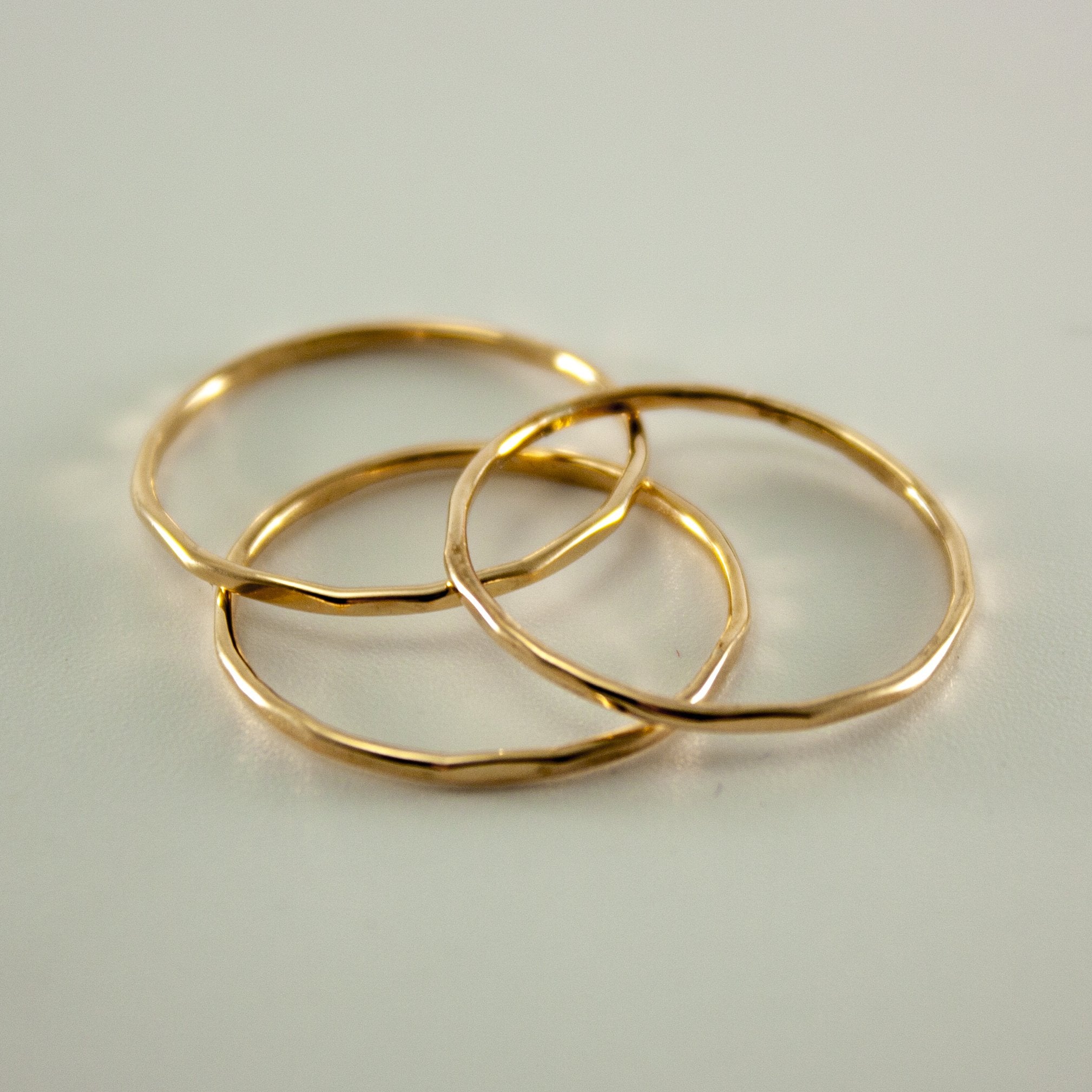 Hammered 14k gold-filled slim ring stack from Grey Clymene showcases layered minimalist jewelry design.