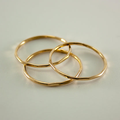 Hammered 14k gold-filled slim ring stack from Grey Clymene showcases layered minimalist jewelry design.