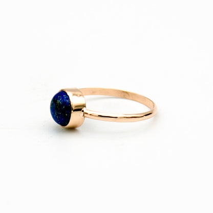 Lapis Lazuli round bezel ring with 14k gold-filled band by Grey Clymene, close-up view of the elegant jewelry piece.