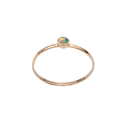 Dainty Ethiopian Opal bezel ring in 14k gold filled jewelry, showcasing a vibrant opal gemstone on a delicate band.