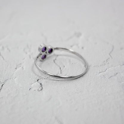 Sterling silver ring featuring a vibrant amethyst cluster gemstone, designed by Grey Clymene in jewelry and watches collection.