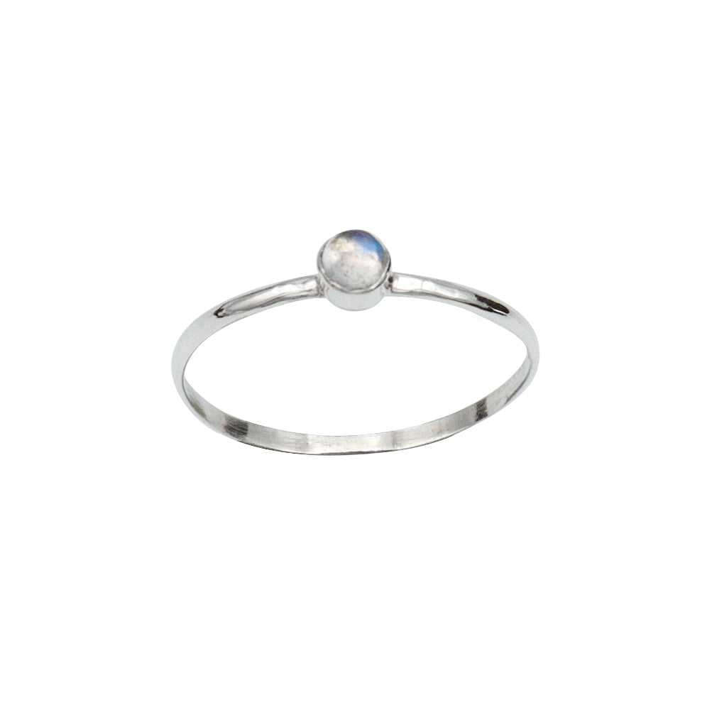 Dainty rainbow moonstone round bezel sterling silver ring from Grey Clymene, showcasing a smooth, polished gemstone setting.