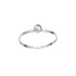Dainty rainbow moonstone round bezel sterling silver ring from Grey Clymene, showcasing a smooth, polished gemstone setting.
