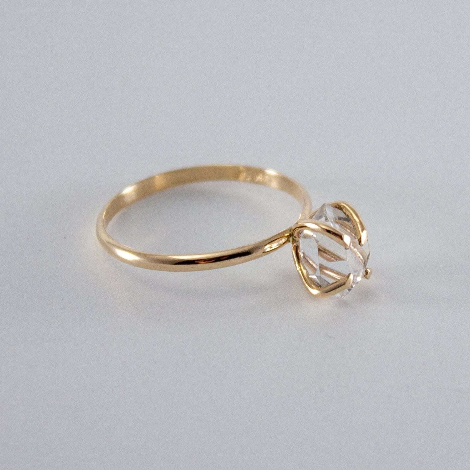 Raw Herkimer diamond 14k gold-filled prong ring by Grey Clymene, showcasing the sparkling raw diamond set in a gold band.