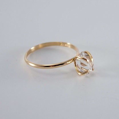 Raw Herkimer diamond 14k gold-filled prong ring by Grey Clymene, showcasing the sparkling raw diamond set in a gold band.