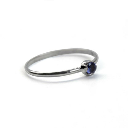 Sterling silver dainty solitaire ring featuring a smooth Iolite gemstone, designed by Grey Clymene in jewelry and watches.