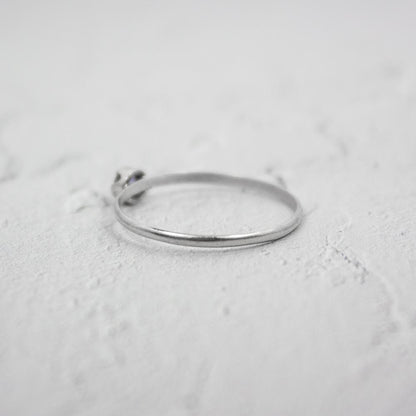 Sterling silver dainty Iolite solitaire ring with a round blue gemstone, elegant jewelry piece by Grey Clymene.