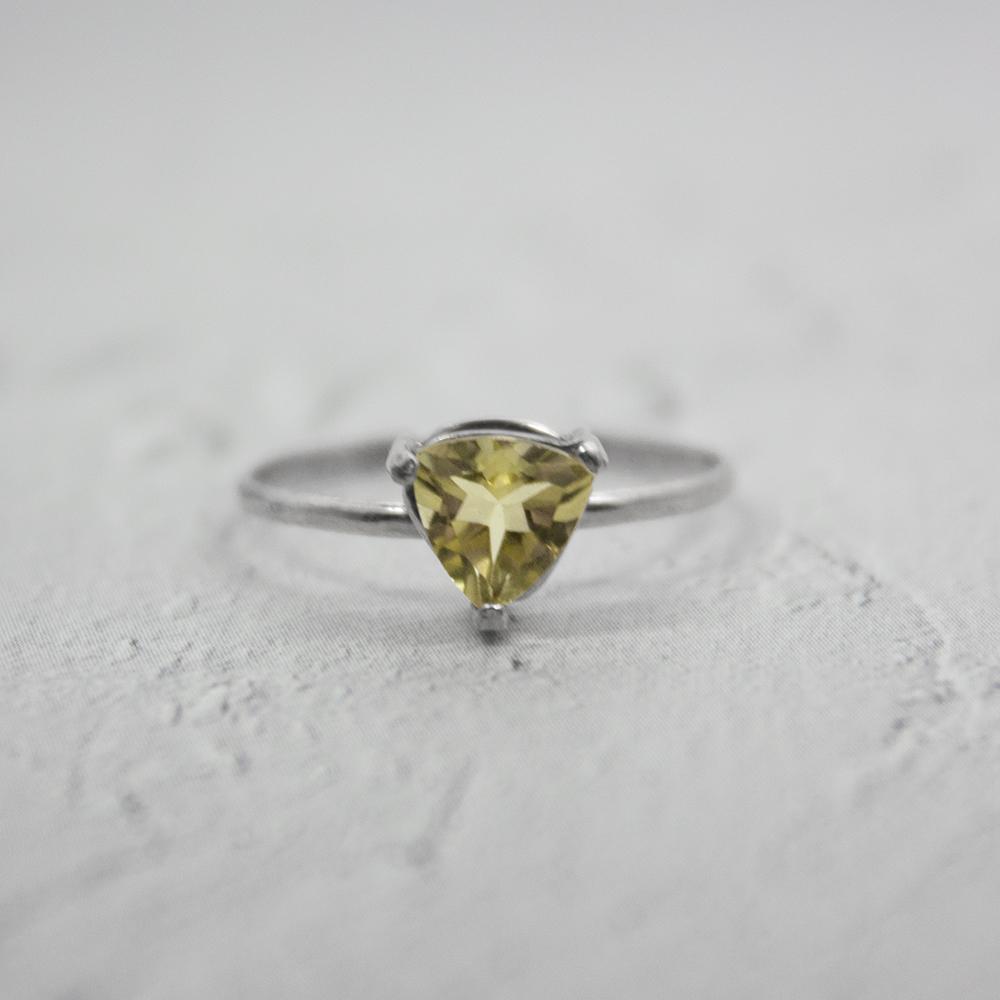 Sterling silver Lemon Topaz trillion-shaped solitaire ring featuring a bright yellow gemstone in a sleek jewelry design.