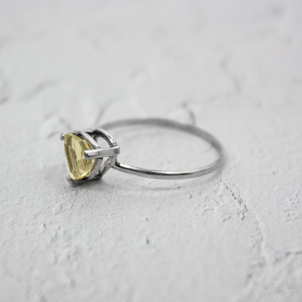 Sterling silver Lemon Topaz trillion solitaire ring with a faceted lemon-colored gemstone, elegant jewelry by Grey Clymene.