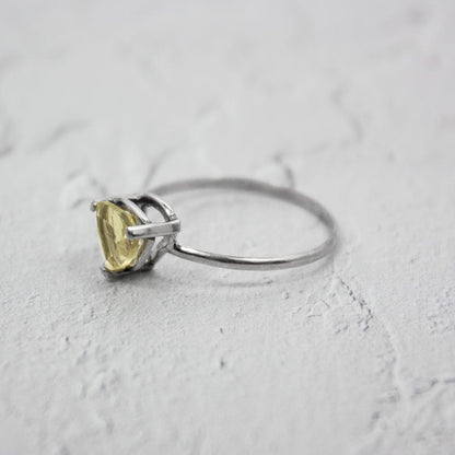 Sterling silver Lemon Topaz trillion solitaire ring with a faceted lemon-colored gemstone, elegant jewelry by Grey Clymene.
