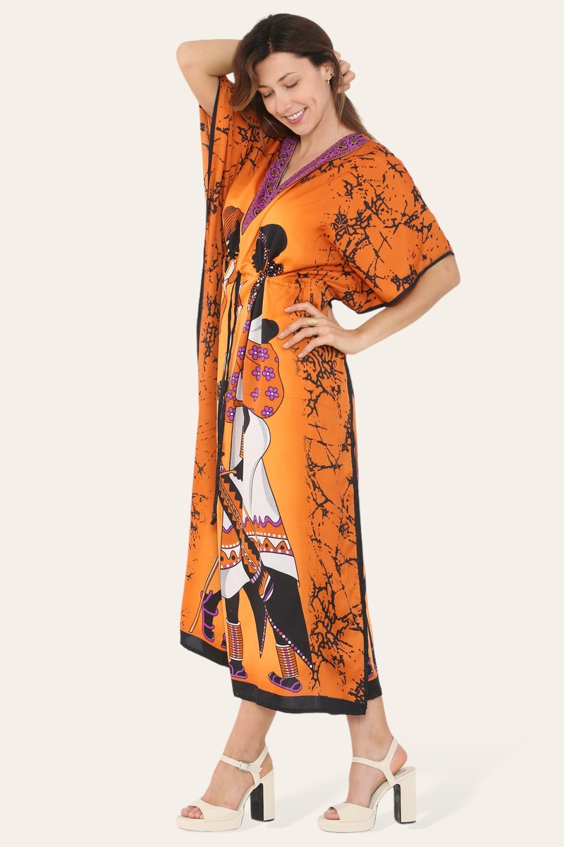 Orange African print caftan dress for women by Coffee Diomedes, featuring traditional style and vibrant fabric design.