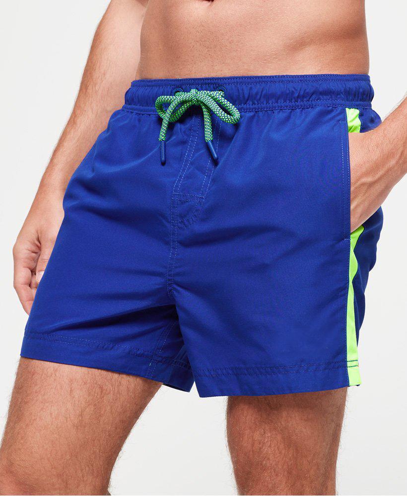 Royal blue stripe swim shorts by Sky Felix, featuring a vibrant pattern and comfortable fit, displayed on a plain background.