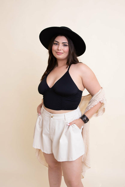 Black ruched bralette tank top from Periwinkle Aether, featuring a comfortable fit and stylish design.