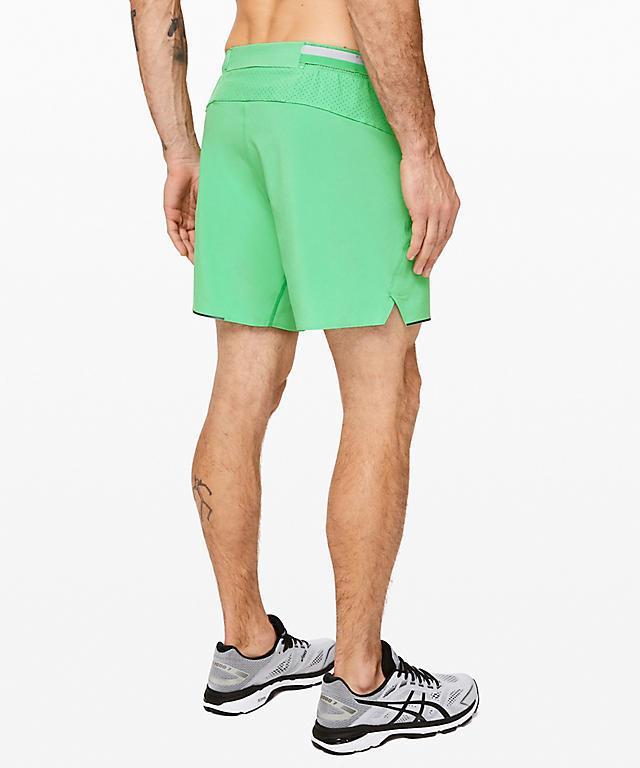 Green Tropix running shorts by Sky Felix, lightweight athletic shorts with breathable fabric and comfortable fit.