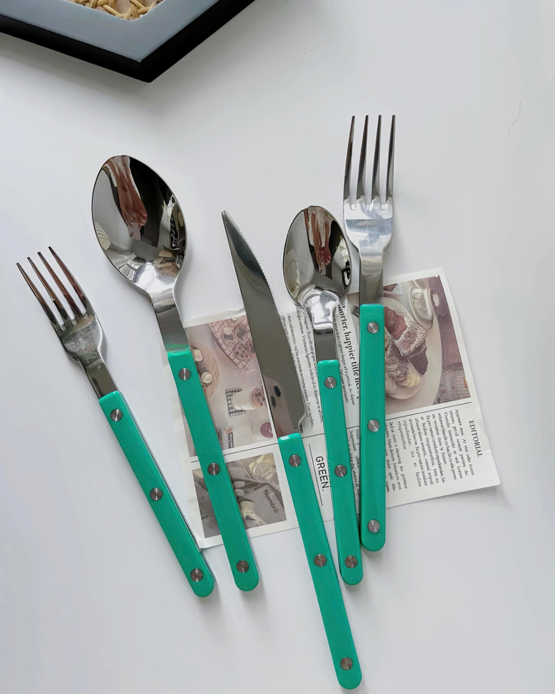 Set of 10 modern French Rivet Bistrot style flatware, elegant silverware with a contemporary design, ideal for home decor.