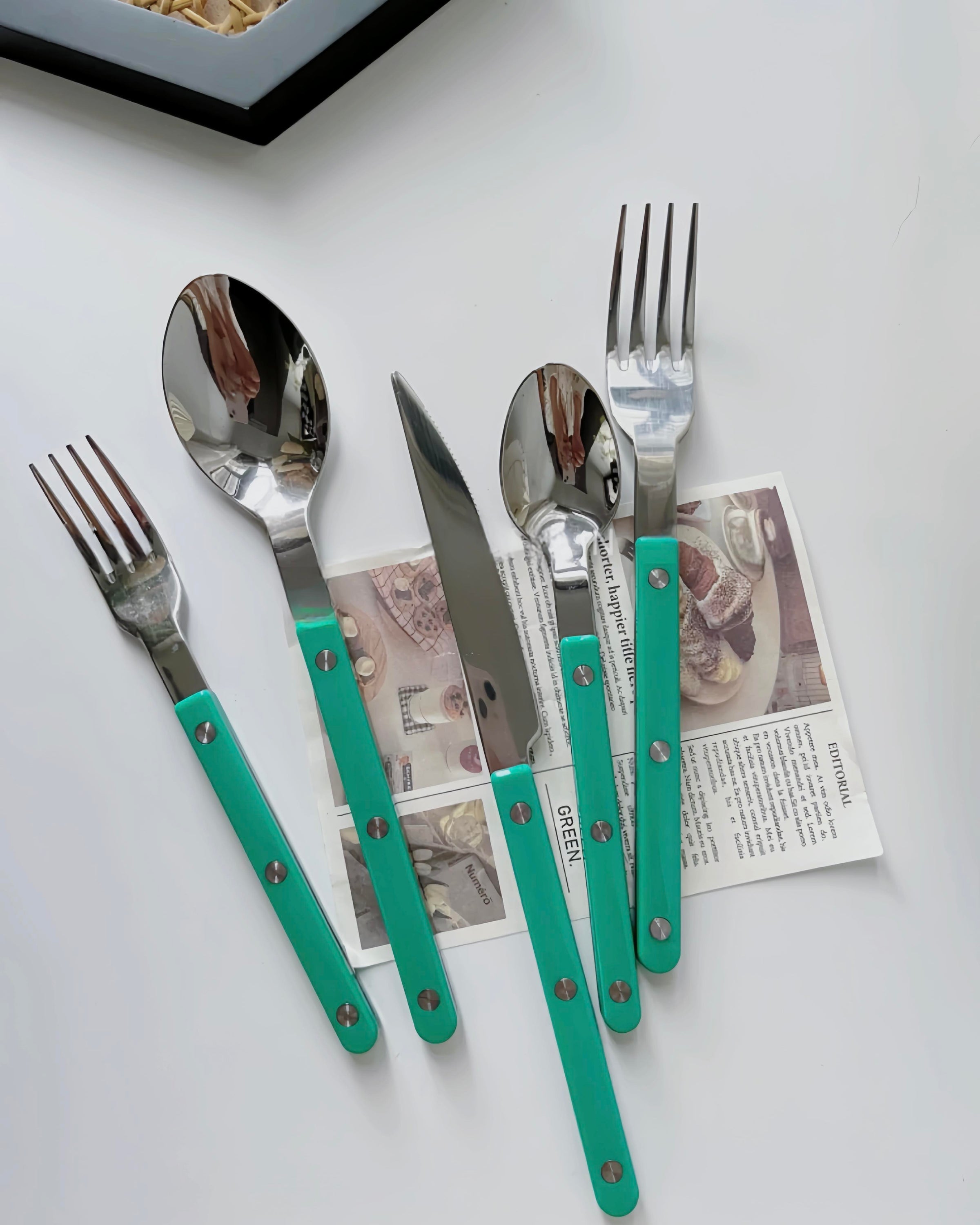 Set of 10 modern French Rivet Bistrot style flatware, elegant silverware with a contemporary design, ideal for home decor.