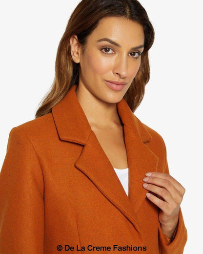 Rose Eleusis Sara Covert button-up coat displayed on a hanger, showcasing its tailored design and classic collar.