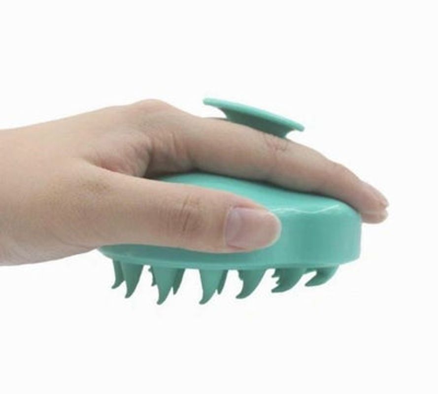 Violet Atlas scalp massager with flexible silicone bristles for relaxing hair and scalp therapy, suitable for bath and beauty use.