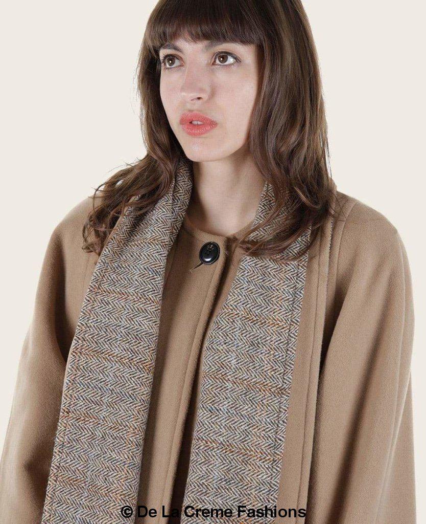 Rose Eleusis Scarpia wool and cashmere overcoat with elegant scarf detail, showcasing a luxurious tailored jacket.