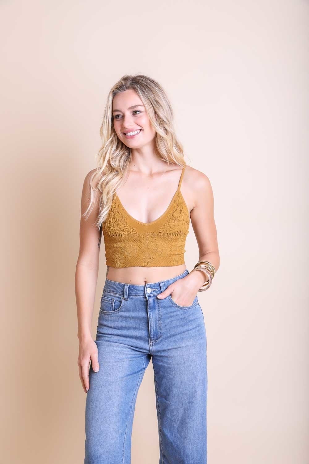 Seamless textured stretchable brami top by Periwinkle Aether, designed for comfort and active lifestyles, featuring padding.