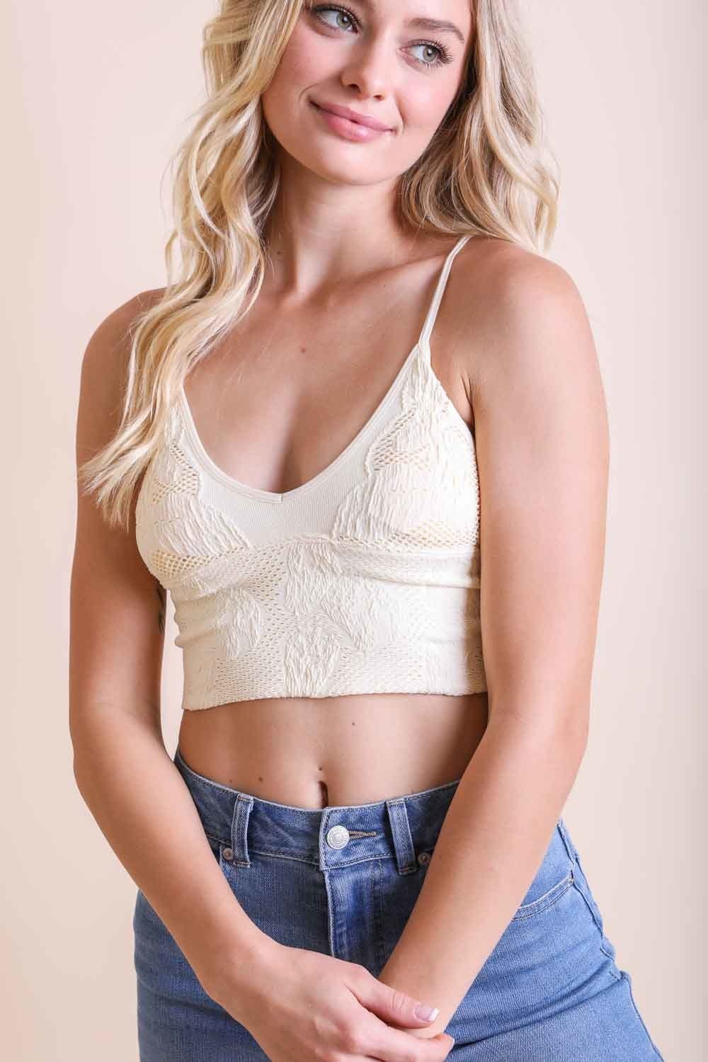 Seamless ivory stretchable brami top by Periwinkle Aether with textured, padded design, perfect for active comfort and everyday wear.