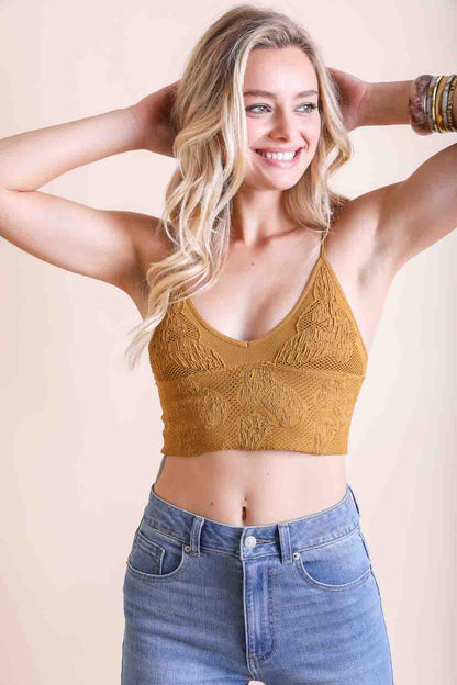 Seamless mustard-colored stretchable brami top by Periwinkle Aether, textured fabric, padded for comfort, ideal for active wear.