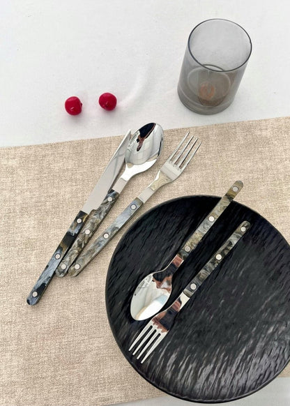 Set of 10 modern elegant Terra flatware Bistrot style cutlery in silver finish, displayed on a stylish home decor table setting