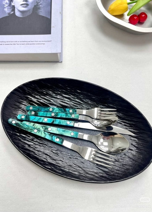 Set of 10 modern elegant Terra flatware in Bistrot style, including forks, knives, and spoons in a sleek silver finish.