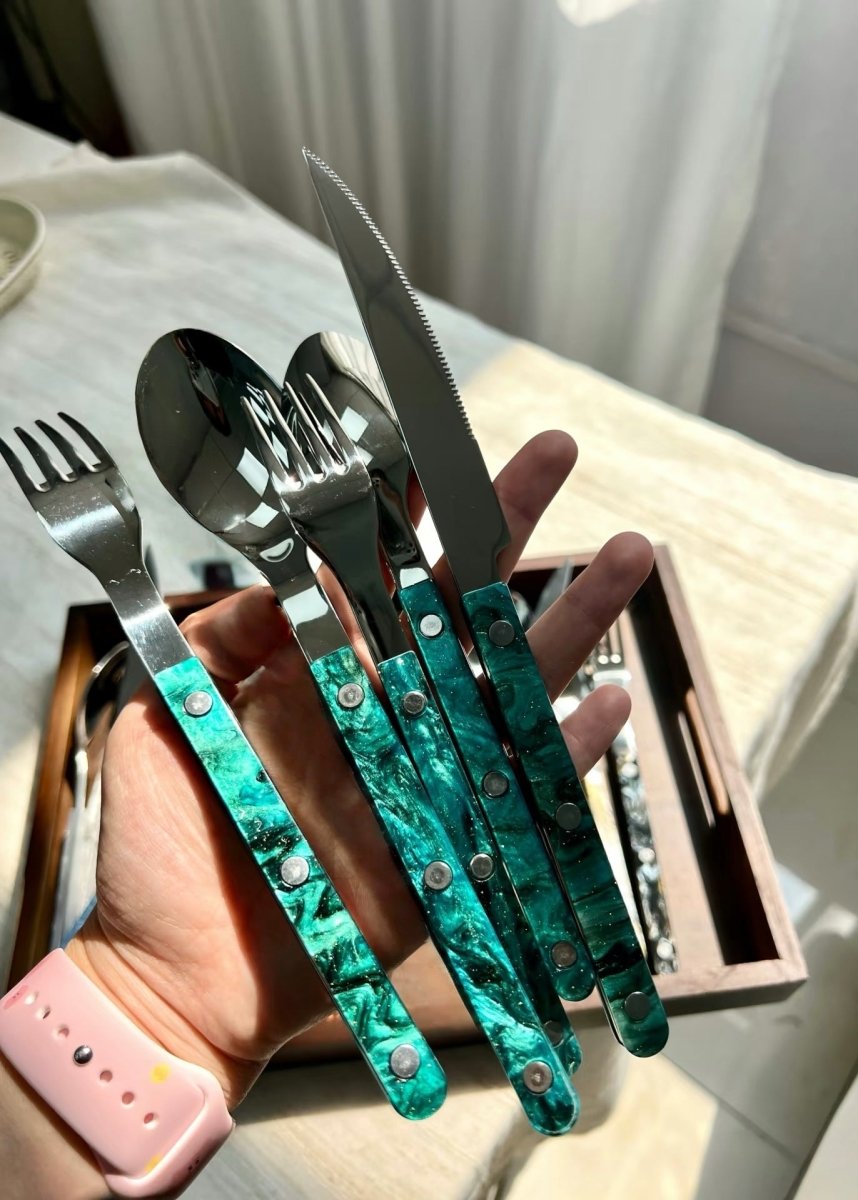 Set of 10 modern elegant Terra flatware Bistrot style cutlery in silver, arranged on a dining table for home decor.