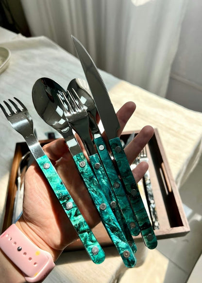 Set of 10 modern elegant Terra flatware Bistrot style cutlery in silver, arranged on a dining table for home decor.