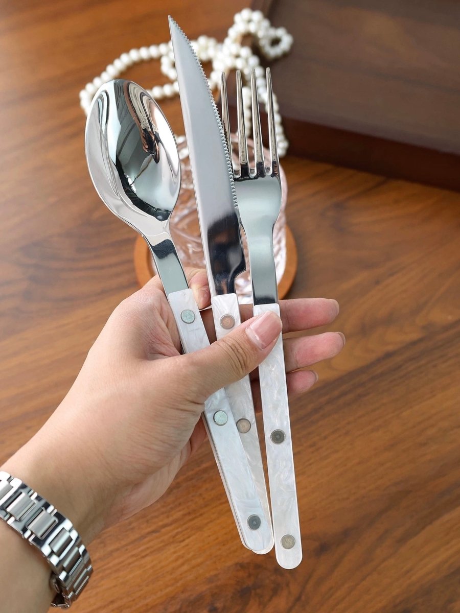 Set of 10 modern nebula bistrot style rivet flatware cutlery set by Inspecial Home, includes forks, knives, and spoons.
