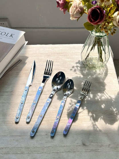 Set of 10 modern Nebula cutlery in Bistrot style with rivet details, featuring sleek flatware for stylish home decor.