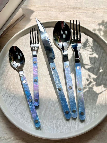 Set of 10 modern nebula bistrot style rivet flatware cutlery set for home decor, featuring sleek stainless steel utensils.