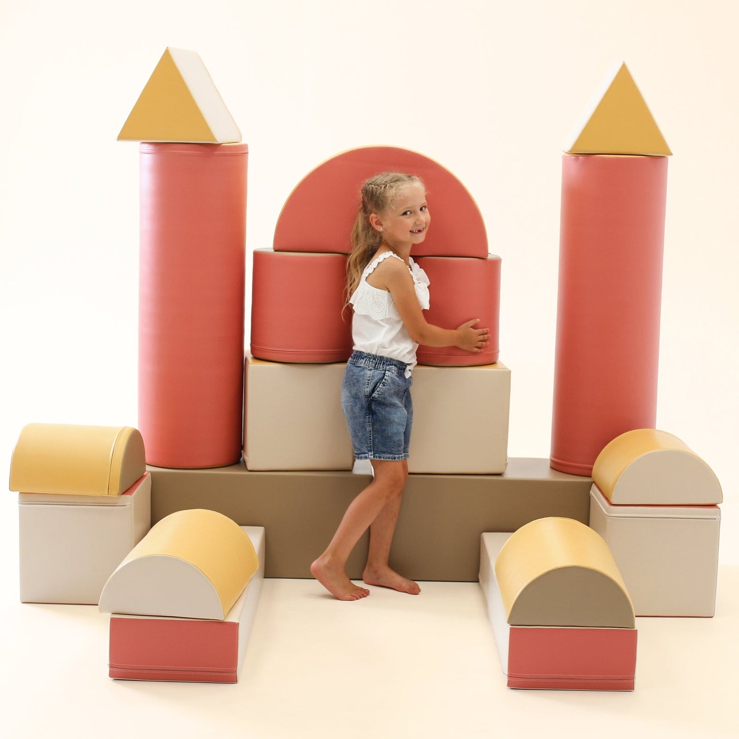 Blush Apricot Mega Fort furniture set with pastel pink fabric, featuring a cozy, multi-room play fort for kids.