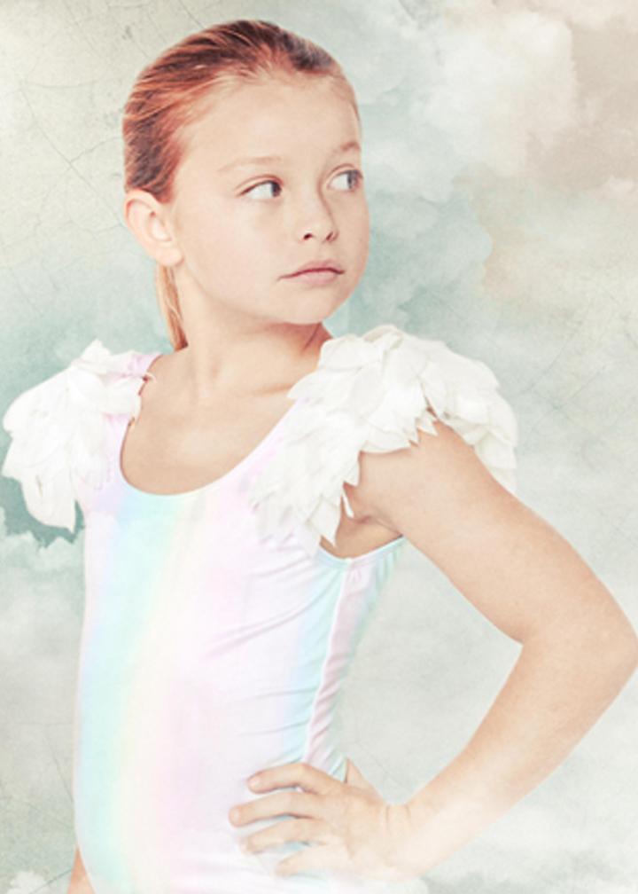 Colorful rainbow tank swimsuit for kids with petal accents, made by Ivory Trillium, featuring bright, playful floral design.
