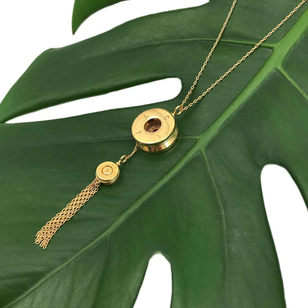 Ariel Bullet Tassel Necklace featuring a sleek slate-colored bullet pendant with tassel details on a delicate chain.