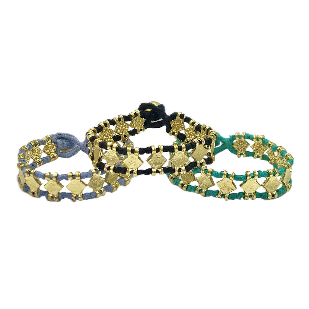 Ariel Amara bracelet featuring slate and salt-colored beads on a delicate braided cord, handcrafted fair trade jewelry.