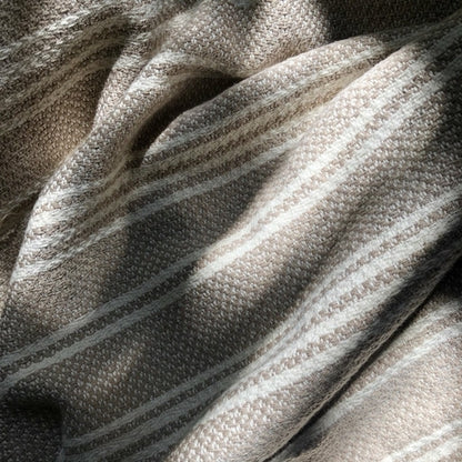 Ariel woven stripe Turkish throw blanket with slate and salt-colored stripes, perfect for cozy home decor.