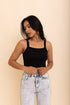 Black Seamless Brami Top by Periwinkle Aether, showcasing its sleek, fitted design and smooth fabric for comfortable wear.