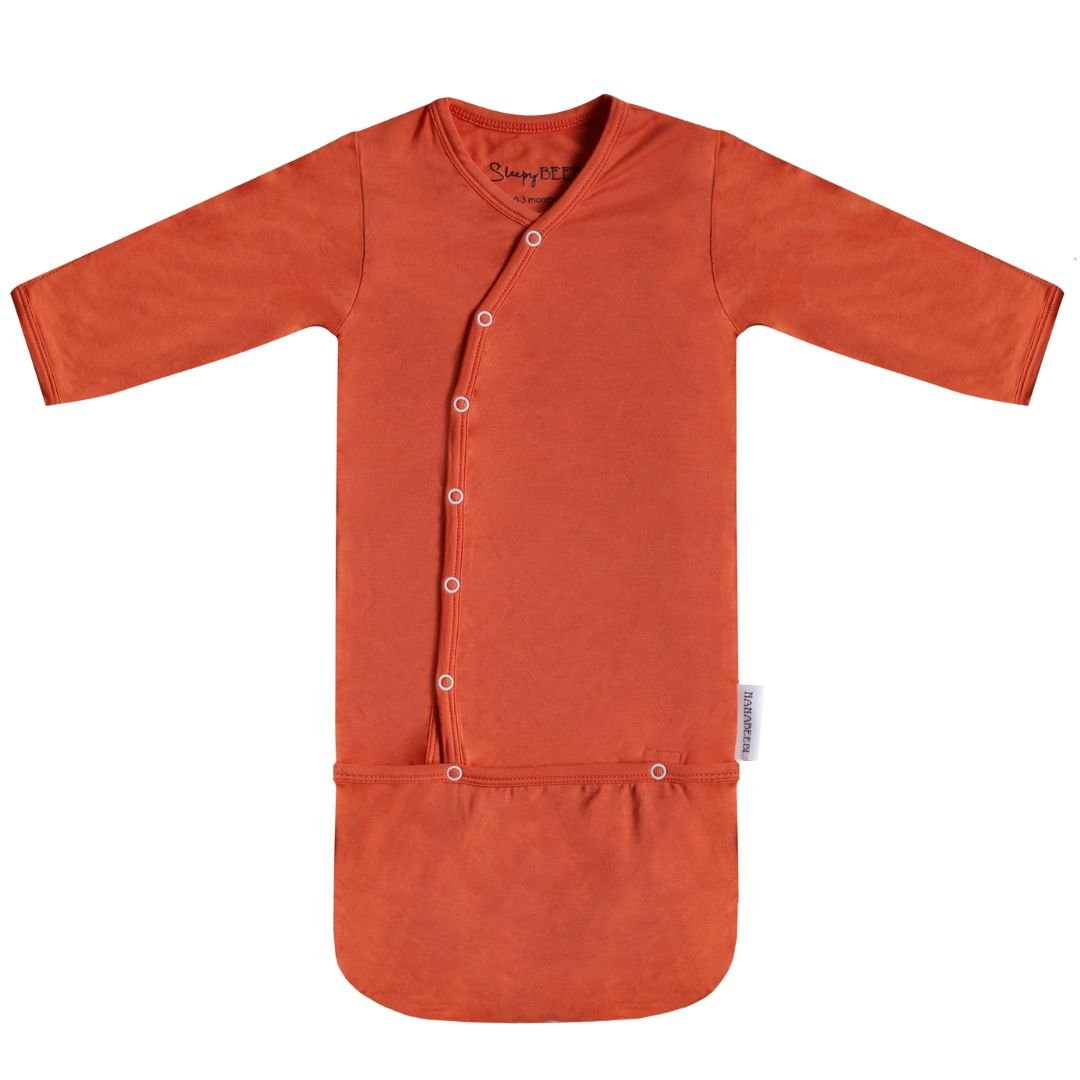 Ochre Athena SleepyBeebi onesie with trappelzak for baby, featuring soft fabric and cozy design perfect for restful sleep.
