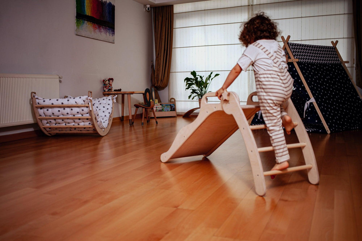 Foldable wooden slide from Red Oceanus, showcasing smooth, natural wood finish and compact design for children&