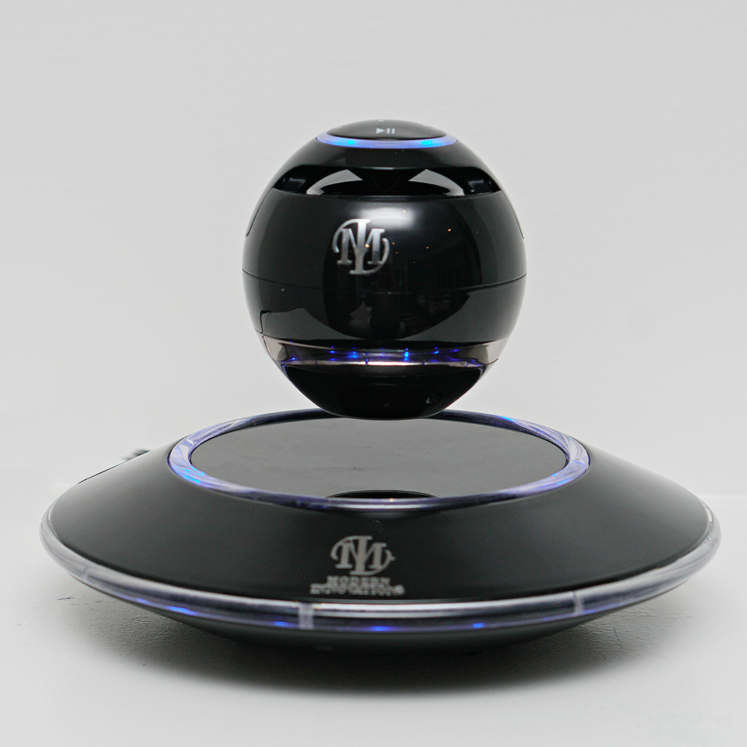 Black and white Levitating Bluetooth speaker by Pink Trillium, showcasing its floating design and sleek audio technology.