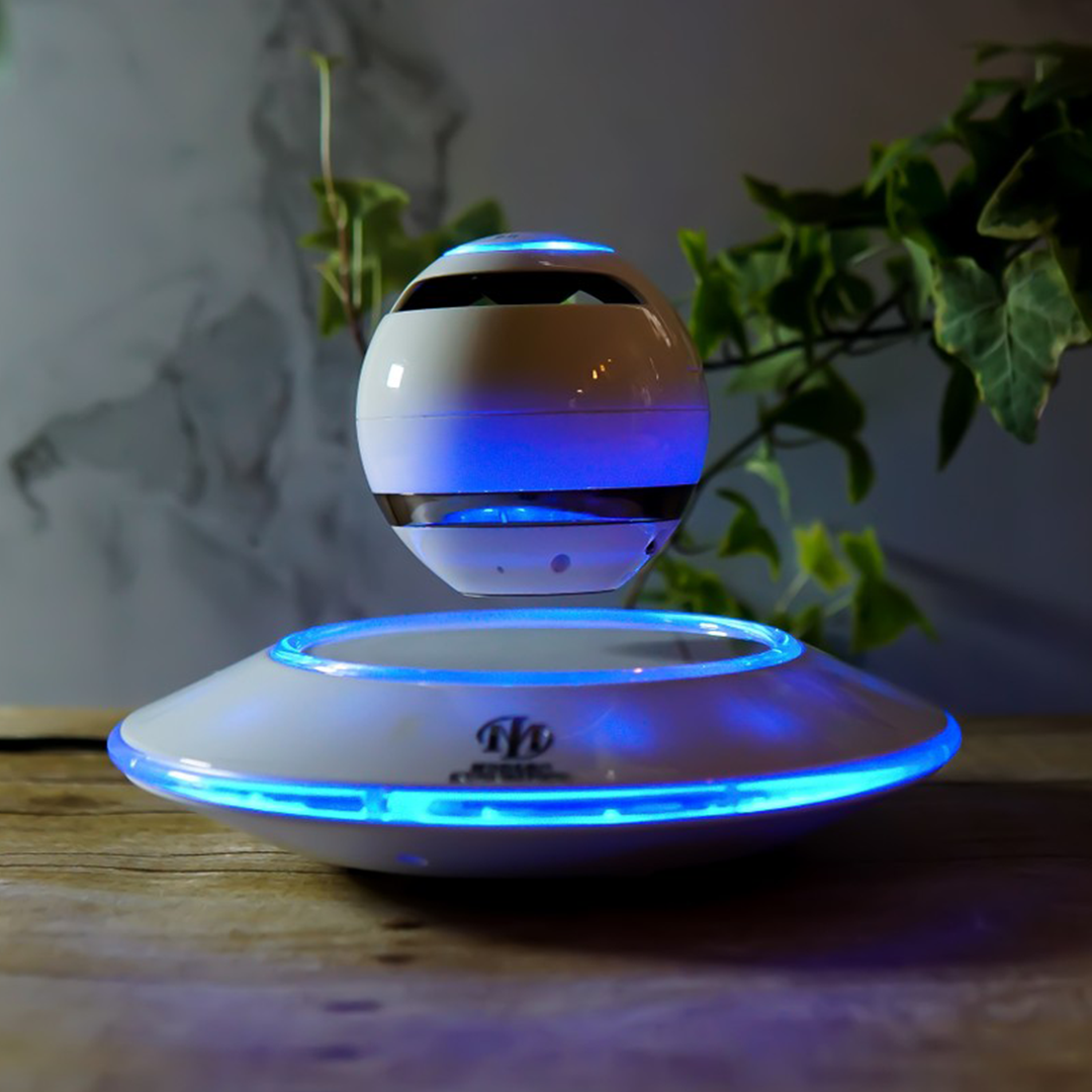 Black and white levitating Bluetooth speaker by Pink Trillium with sleek design and floating effect in an audio and video product image.