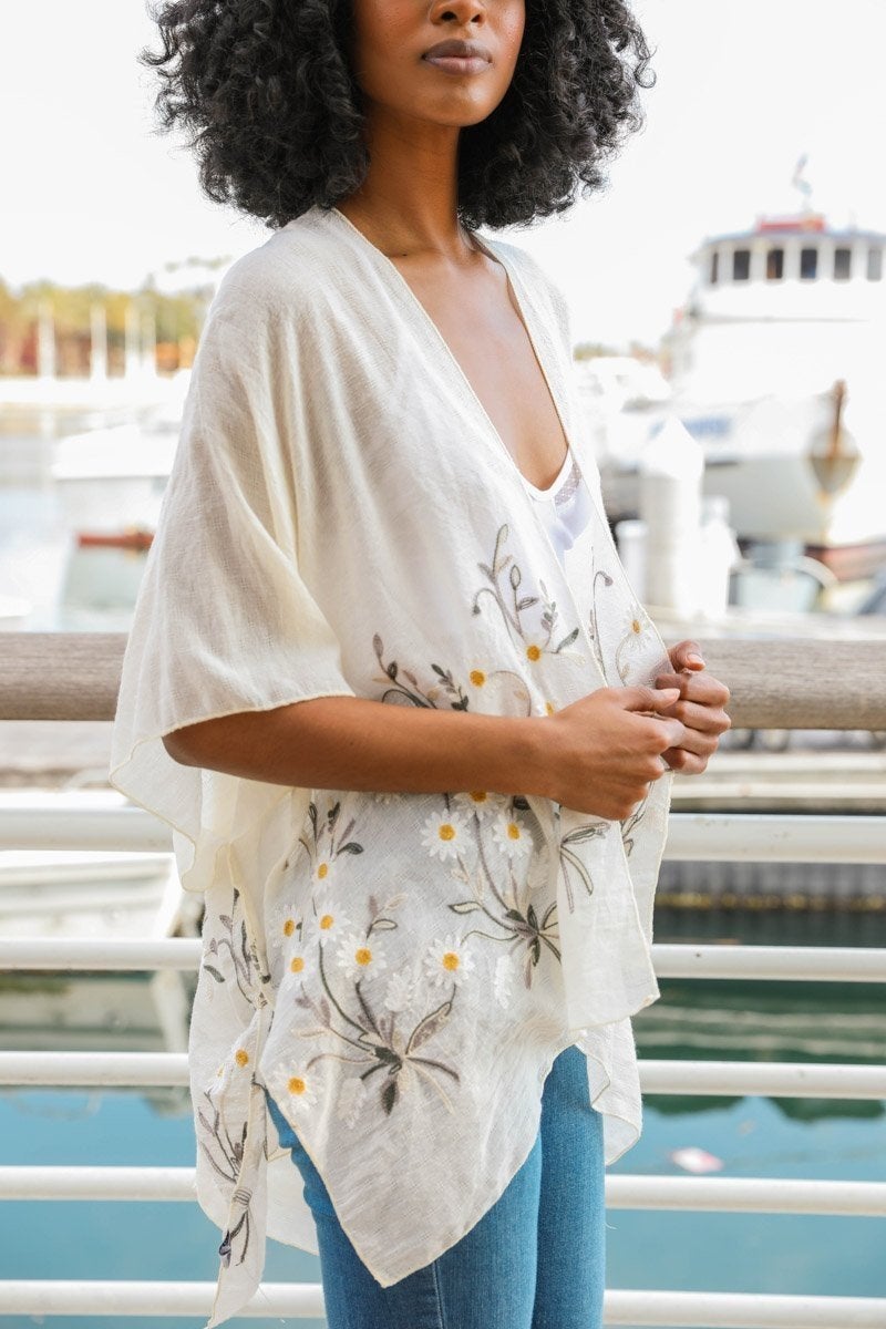Periwinkle Aether Spring Daisy Kimono top with floral design, lightweight fabric, and flowing sleeves perfect for spring wear.