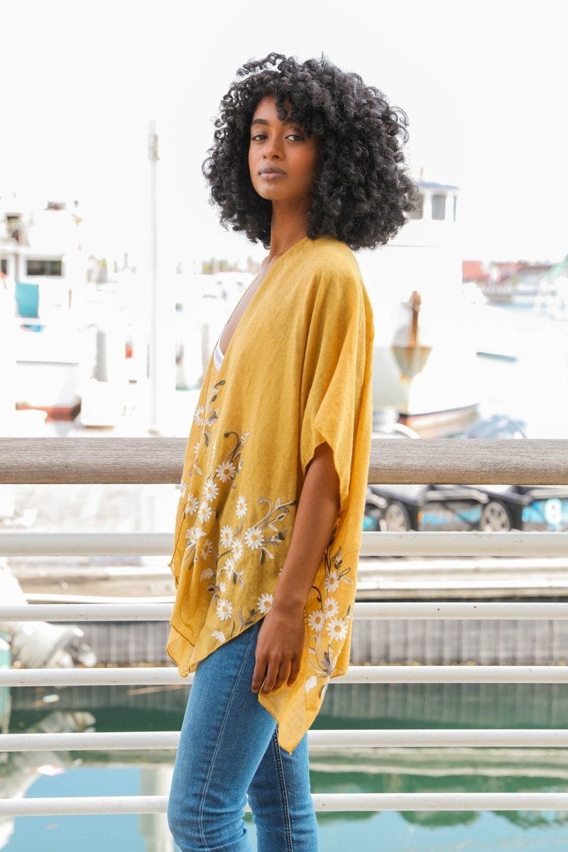 Spring Daisy Kimono from Periwinkle Aether, a lightweight blouse with a floral daisy print, perfect for casual spring wear.