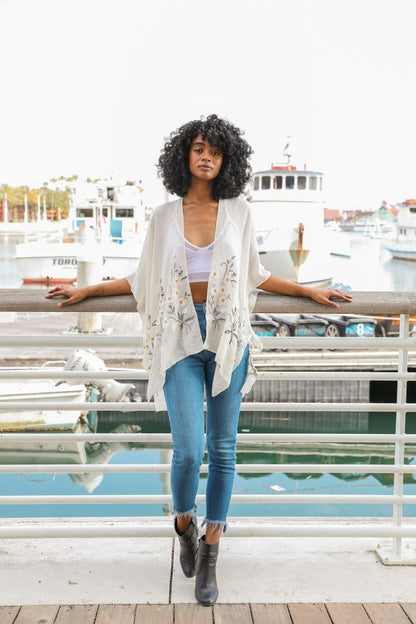 Ivory Spring Daisy Kimono blouse by Periwinkle Aether featuring floral print, lightweight fabric, and relaxed fit.