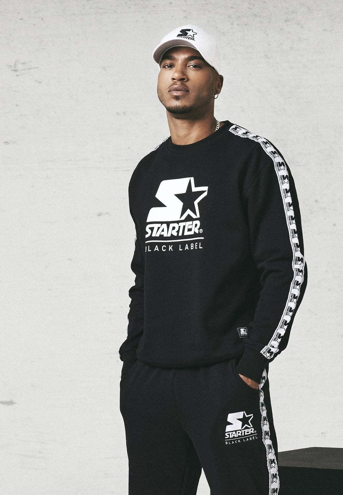 Callisto Starter Logo Taped Crewneck sweatshirt featuring a logo design, soft fabric, and ribbed cuffs in a casual style.