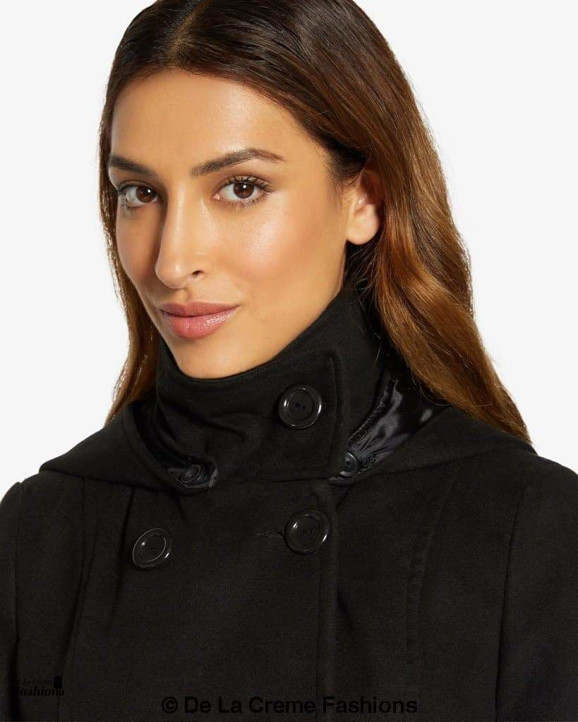 Rose Eleusis double-breasted hooded coat, stylish jacket with a hood and tailored fit, shown in a natural outdoor setting.